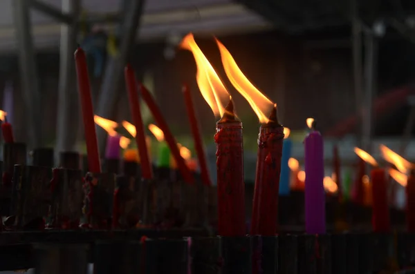 Burning red candle sticks. candle for praying Buddha or Hindu gods to show worship.
