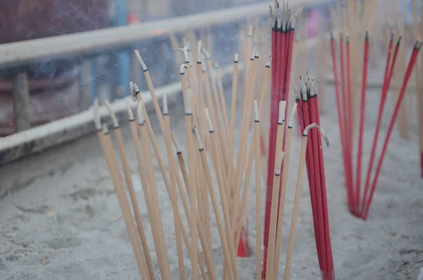 Burning aroma incense sticks in the incense burner. Incense for praying Buddha or Hindu gods to show worship.