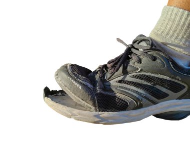 side view of torn shoes, shoes in need of repair isolated on white background with clipping path