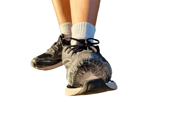 front view of torn shoes, closeup shoes in need of repair isolated on white background with clipping path