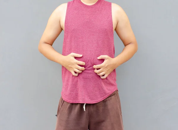 アジア人男性傷手で腹の領域 健康管理の概念 — ストック写真