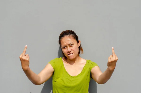 Asian Woman Showing Both Middle Fingers Impolite Rude Fuck Expression — стоковое фото