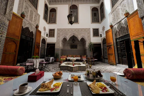 Moroccan breakfast served inside a luxurious riad in the old medina of Fez