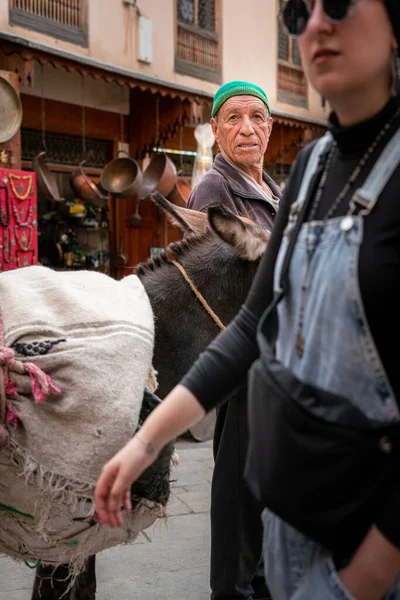 stock image Man standing beside his donkey in the old medina of Fez