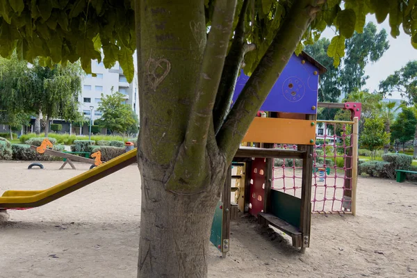 stock image A slider on the sand in a children's playground