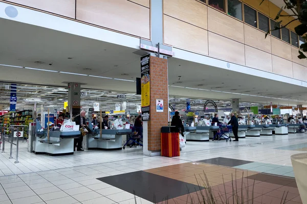 stock image People checking out at the cash registers inside Cora hypermarket in Bruxelles