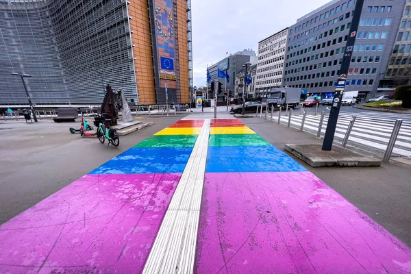 stock image Pedestrian rainbow colored zebra crossing markings in LGBT colors in front of the headquarters of the European Commission in Bruxelles