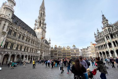 Tourists hanging out at The Grand Place in Brussels, Belgium clipart