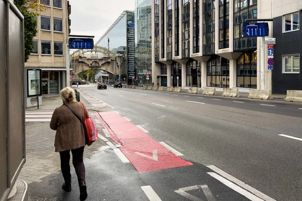 stock image A woman walking on the sidewalk in Brussels