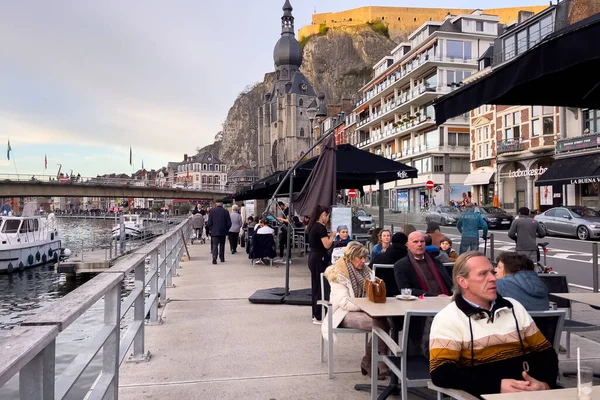 stock image People walking nearby the Notre Dame de Dinant in Belgium