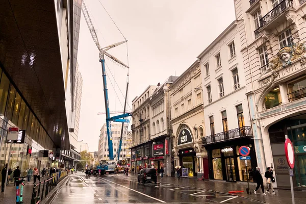 stock image Modern building under reconstruction with a tall crane next to it in Brussels, Belgium