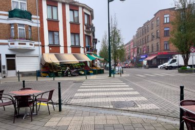 A grocery store selling fresh fruits and vegetables outdoor on the street in Brussels, Belgium