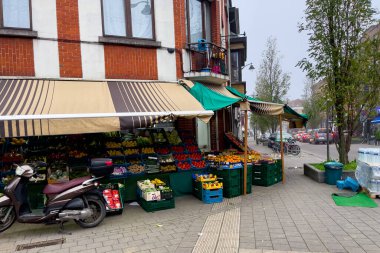 A grocery store selling fresh fruits and vegetables outdoor on the street in Brussels, Belgium