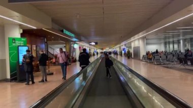 Passengers using the moving walkway inside the Charleroi airport in Brussels, Belgium