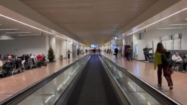 Passengers using the moving walkway inside the Charleroi airport in Brussels, Belgium