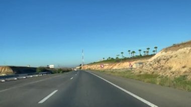 Dashcam view of a car driving on the highway in Morocco