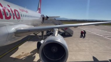 Passengers boarding an Air Arabia commercial airplane at Fes Sais international airport in Morocco