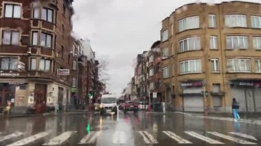 Dashcam of a car driving on the road during a rainy day in Brussels, Belgium