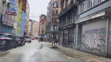 Dashcam of a car driving on the road during a rainy day in Brussels, Belgium