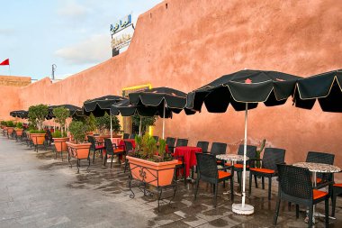 Tables and chairs with parasols outside El Bahia restaurant in the old town of Rabat, Morocco