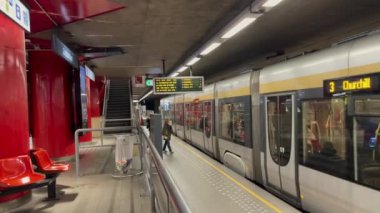 Passengers getting off a metro train after arriving at the subway station in Brussels, Belgium
