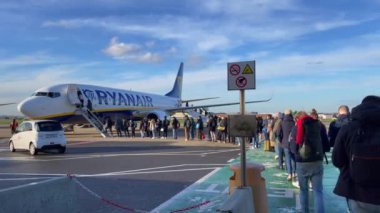 Passengers boarding a Ryanair commercial airplane at Zaventem international airport in Belgium