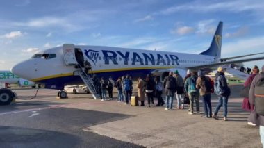Passengers boarding a Ryanair commercial airplane at Zaventem international airport in Belgium