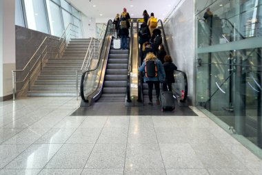 Passengers taking the escalator inside Brussels Airport-Zaventem in Belgium