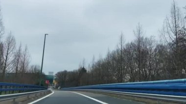 Dashcam of a car driving on the road during a rainy day in Brussels, Belgium