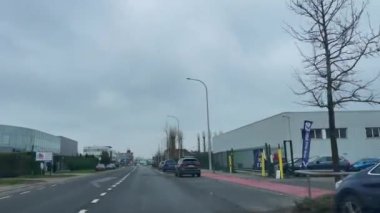 Dashcam of a car driving on the road during a rainy day in Brussels, Belgium