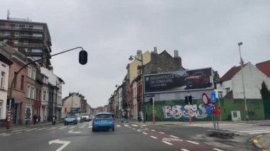 Dashcam of a car driving on the road during a rainy day in Brussels, Belgium