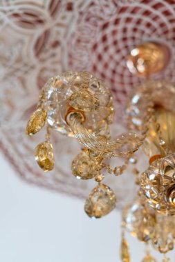 Crystal chandelier hanging on a white ceiling