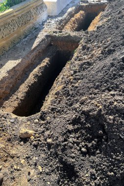 Empty grave plot at a Muslim cemetery