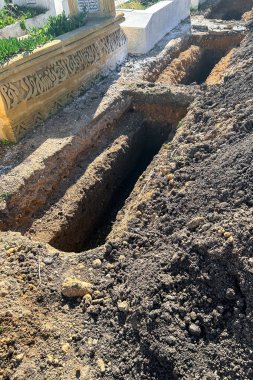 Empty grave plot at a Muslim cemetery
