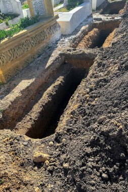 Empty grave plot at a Muslim cemetery