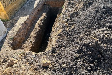 Empty grave plot at a Muslim cemetery