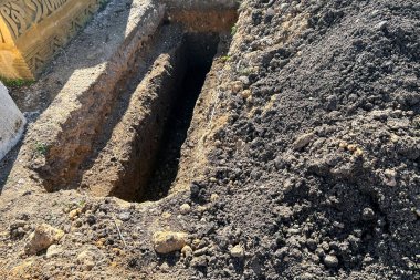 Empty grave plot at a Muslim cemetery