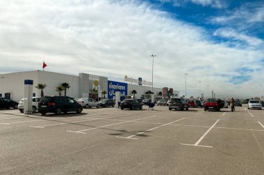 Marjane supermarket building with cars parked in the parking lot in Fes