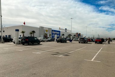Marjane supermarket building with cars parked in the parking lot in Fes