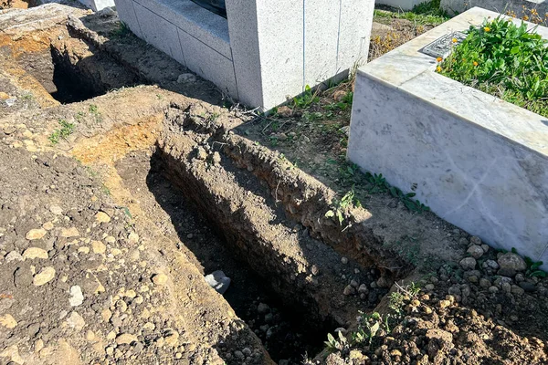 Empty grave plot at a Muslim cemetery