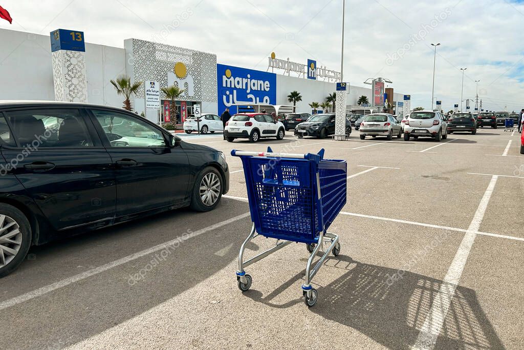Empty car at the parking lot next to Marjane supermarket building in Fes