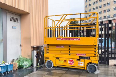 Electric scissor lift parked at the railway station in Tanger, Morocco
