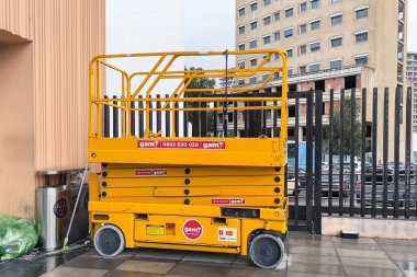 Electric scissor lift parked at the railway station in Tanger, Morocco