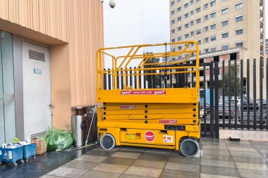 Electric scissor lift parked at the railway station in Tanger, Morocco