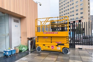Electric scissor lift parked at the railway station in Tanger, Morocco