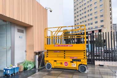 Electric scissor lift parked at the railway station in Tanger, Morocco