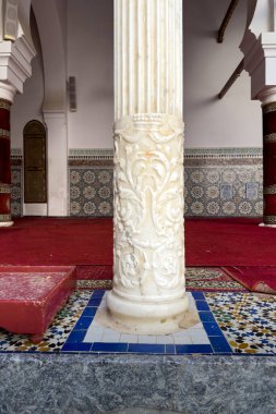 Mosque columns carved with Arabic patterns Zawiya of Moulay Idris II in the medina of Fez, Morocco