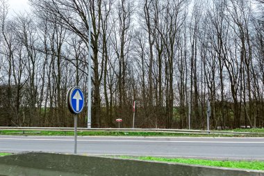 Car window view passing on the highway through a countryside in Belgium