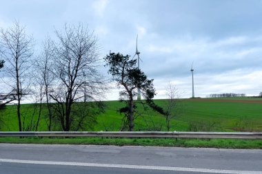 Car window view passing on the highway through a countryside in Belgium