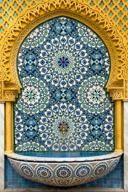 Traditional Moroccan wall fountain in a Jnan Sbil Gardens in Fez clipart